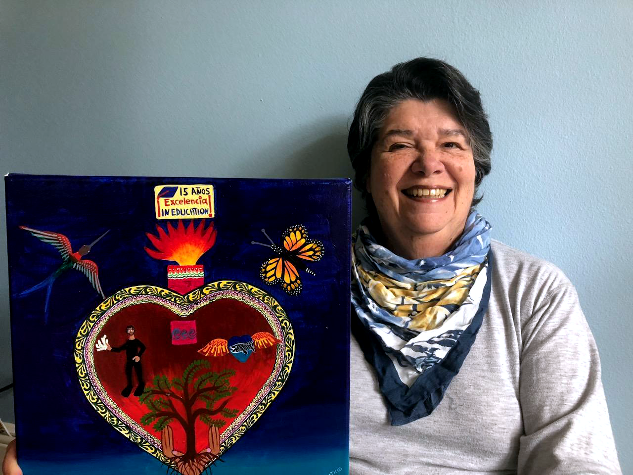 Estela Lopez with Excelencia's heart painting